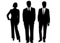 Silhouette of three business people in suits